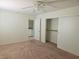Cozy bedroom with closet and door leading to utility room at 8452 Boseck Dr # 216, Las Vegas, NV 89145