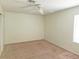Bright bedroom with ceiling fan and natural light at 8452 Boseck Dr # 216, Las Vegas, NV 89145