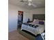 Bedroom featuring a tufted headboard bed with a closet, and soft carpeted flooring at 8452 Boseck Dr # 216, Las Vegas, NV 89145