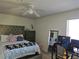 Bedroom with a tufted headboard bed, carpeted floors, ceiling fan and dresser at 8452 Boseck Dr # 216, Las Vegas, NV 89145