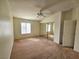 Bright bedroom featuring a ceiling fan, mirrored closet, and natural light at 8452 Boseck Dr # 216, Las Vegas, NV 89145