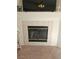 Tiled fireplace with a black mesh screen beneath a mounted flat-screen TV at 8452 Boseck Dr # 216, Las Vegas, NV 89145