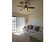Bright living room featuring a sliding glass door, plush couch, and soft natural light at 8452 Boseck Dr # 216, Las Vegas, NV 89145