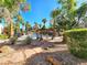 Relaxing pool area featuring a stone walkway, pergola, and lush landscaping at 8452 Boseck Dr # 216, Las Vegas, NV 89145