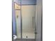 Bathroom featuring a walk-in shower, a modern shower head, and white tile at 904 Rockaway St, Las Vegas, NV 89145