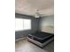 Bedroom showcasing a padded Queen bed frame, a large window, and modern ceiling fan at 904 Rockaway St, Las Vegas, NV 89145