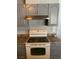 Close-up of the kitchen stove and cabinets at 904 Rockaway St, Las Vegas, NV 89145
