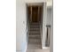 Stairway leads to the upper level, painted in a calming gray with carpeted steps and white trim at 904 Rockaway St, Las Vegas, NV 89145