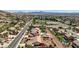 Expansive aerial view of a community with swimming pools, landscaping, and mountain views in the background at 931 Temple View Dr, Las Vegas, NV 89110