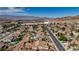 A residential neighborhood with desert landscaping, pools, and views of the cityscape at 931 Temple View Dr, Las Vegas, NV 89110