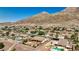 Lovely home boasting a backyard with a pool, fire pit, and desert view at 931 Temple View Dr, Las Vegas, NV 89110