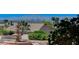 Backyard shot featuring a water fountain set against a city and mountain backdrop at 931 Temple View Dr, Las Vegas, NV 89110