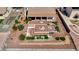 Backyard with a covered patio, water feature, desert landscaping, and brick accents at 931 Temple View Dr, Las Vegas, NV 89110