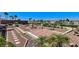 Desert landscaped backyard featuring a fountain, stone pavers, and privacy wall at 931 Temple View Dr, Las Vegas, NV 89110