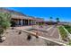 Expansive backyard showcasing desert landscaping, a fountain, and mountain views at 931 Temple View Dr, Las Vegas, NV 89110