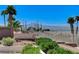 The backyard features lush greenery, and a view of the mountains at 931 Temple View Dr, Las Vegas, NV 89110