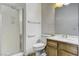 Neutral bathroom featuring a shower, toilet, and vanity with a large mirror at 931 Temple View Dr, Las Vegas, NV 89110
