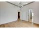 Bedroom showing wood floors, ceiling fan and multiple doorways at 931 Temple View Dr, Las Vegas, NV 89110