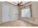 This bedroom is brightly lit with wood-look floors and a ceiling fan at 931 Temple View Dr, Las Vegas, NV 89110