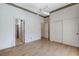 Bedroom featuring wood floors, ceiling fan, closet and ensuite bathroom at 931 Temple View Dr, Las Vegas, NV 89110