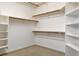 Well-organized walk-in closet featuring ample shelving for storage and organization at 931 Temple View Dr, Las Vegas, NV 89110