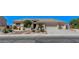 Charming single-story home with landscaped front yard and a three car garage at 931 Temple View Dr, Las Vegas, NV 89110