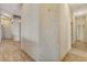 Hallway features wood-look flooring and textured wallpaper at 931 Temple View Dr, Las Vegas, NV 89110