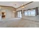 Spacious living room featuring large windows, chandelier and sliding glass door at 931 Temple View Dr, Las Vegas, NV 89110