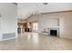 Combined living area featuring a fireplace, tile flooring, and an open layout at 931 Temple View Dr, Las Vegas, NV 89110