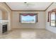 Spacious living area with a fireplace, tile flooring, and scenic neighborhood views at 931 Temple View Dr, Las Vegas, NV 89110