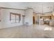 Open-concept space with tile flooring and connecting access to the kitchen at 931 Temple View Dr, Las Vegas, NV 89110