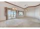 Large living area showcasing sliding doors to a patio and plenty of natural light at 931 Temple View Dr, Las Vegas, NV 89110