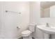 Clean bathroom with toilet, pedestal sink, and chrome fixtures at 9339 Bondeno St, Las Vegas, NV 89123