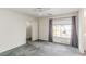 Cozy bedroom with a large window, curtains, and a closet at 9339 Bondeno St, Las Vegas, NV 89123
