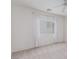 Bright bedroom featuring plush carpeting, a ceiling fan, and two bright windows at 9339 Bondeno St, Las Vegas, NV 89123
