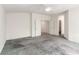 Spacious bedroom with neutral walls, ceiling fan, and dual doors leading to other rooms at 9339 Bondeno St, Las Vegas, NV 89123