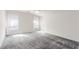 Bright primary bedroom featuring natural light and neutral carpet at 9339 Bondeno St, Las Vegas, NV 89123