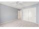 Carpeted bedroom with a double door closet for organized storage at 9339 Bondeno St, Las Vegas, NV 89123