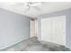 A well-lit bedroom features a ceiling fan and closet space, offering comfortable living at 9339 Bondeno St, Las Vegas, NV 89123