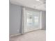 Bedroom features patio doors, carpet floors, and neutral paint at 9339 Bondeno St, Las Vegas, NV 89123
