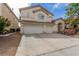 Charming two-story home with a spacious driveway and a well-maintained front yard at 9339 Bondeno St, Las Vegas, NV 89123