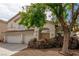 Charming two-story home with a spacious driveway, mature landscaping, and a welcoming entrance at 9339 Bondeno St, Las Vegas, NV 89123
