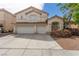 Charming two-story home with a spacious driveway and a well-maintained front yard at 9339 Bondeno St, Las Vegas, NV 89123