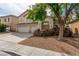Charming two-story home with a spacious driveway, mature landscaping, and a welcoming entrance at 9339 Bondeno St, Las Vegas, NV 89123