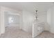 Upstairs hallway leading into bright bedroom with adjacent glass railing detail at 9339 Bondeno St, Las Vegas, NV 89123
