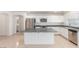 Modern kitchen features stainless appliances and a kitchen island at 9339 Bondeno St, Las Vegas, NV 89123