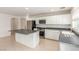 Bright kitchen with stainless steel appliances, center island, and white cabinets at 9339 Bondeno St, Las Vegas, NV 89123