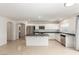 Bright open kitchen with stainless steel appliances, center island, and pantry at 9339 Bondeno St, Las Vegas, NV 89123