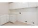 A convenient laundry room features white cabinets, countertop space and utility connections at 9339 Bondeno St, Las Vegas, NV 89123