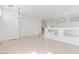 Spacious living area with sleek flooring, staircase, and ample natural light at 9339 Bondeno St, Las Vegas, NV 89123